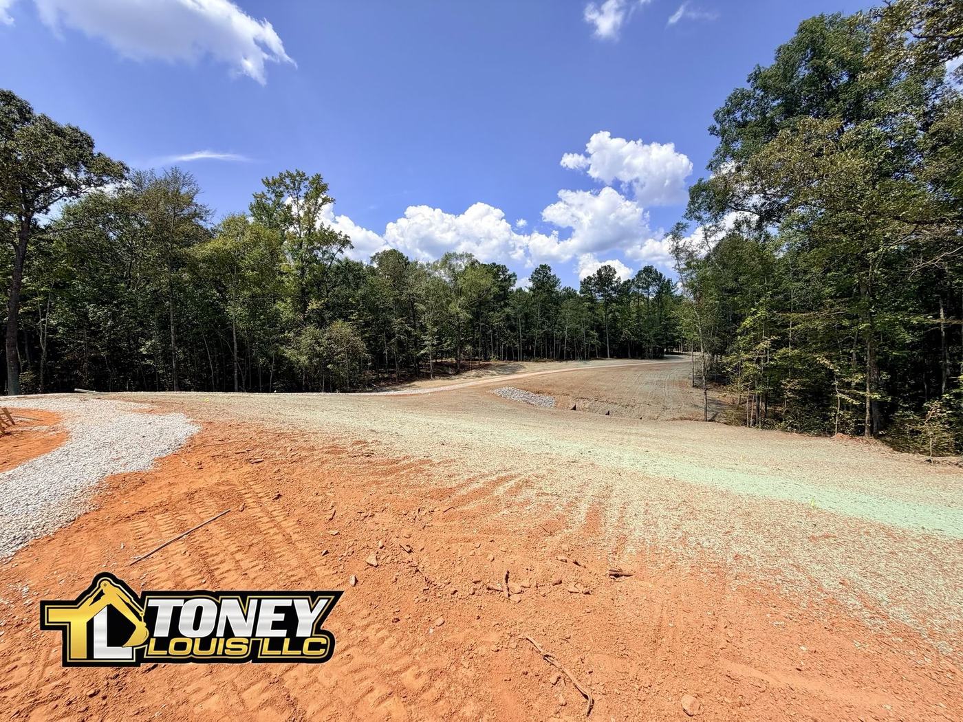Graded and hydroseeded drive with stone and a culvert